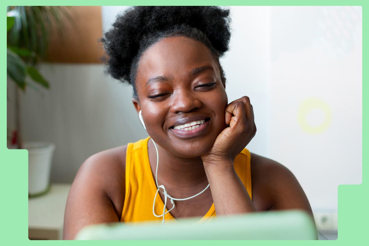 Woman smiling looking at her laptop