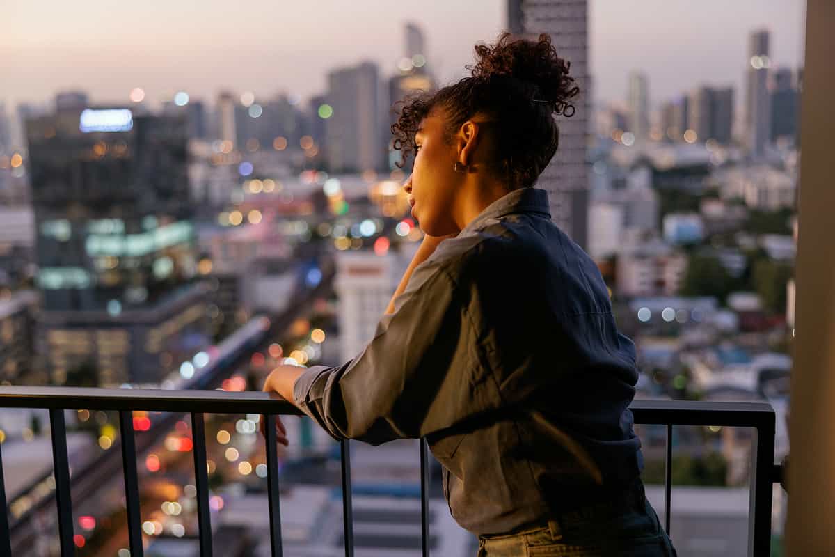 woman looking out at city