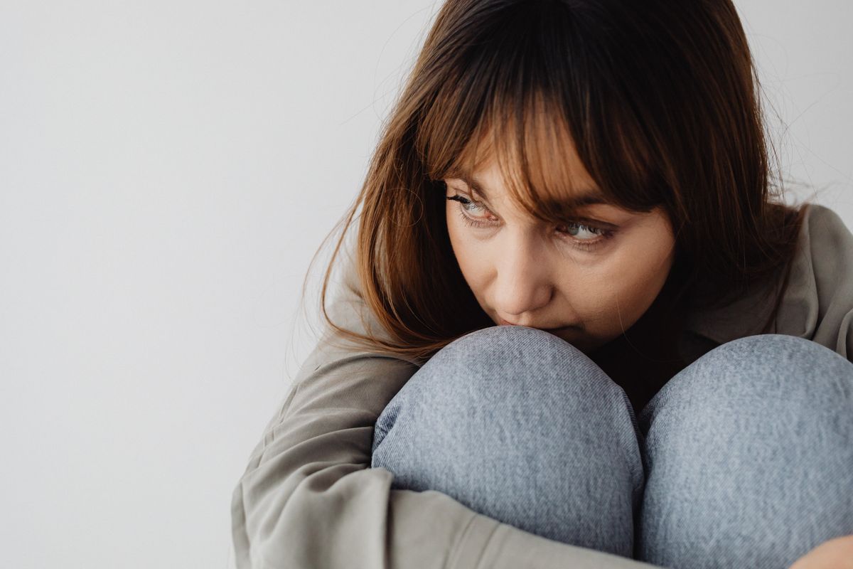 Woman Hugging her Knees