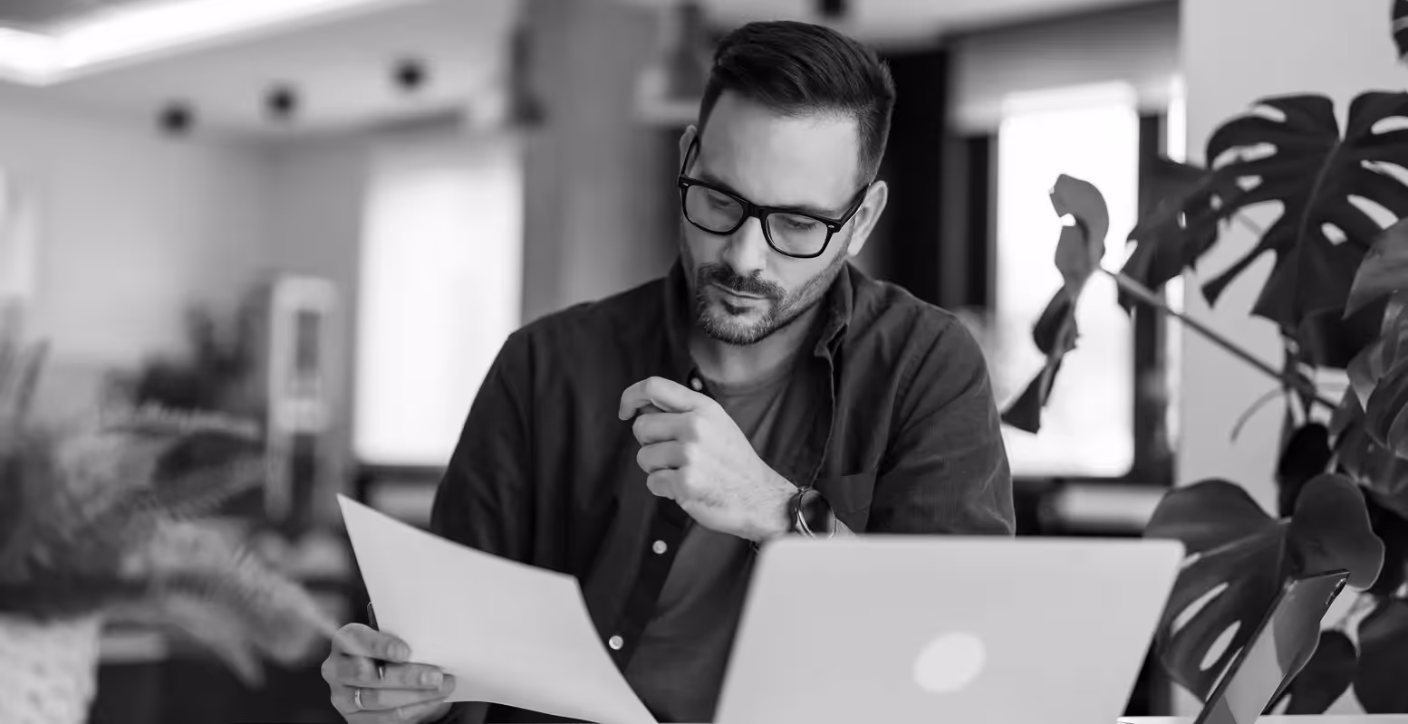 Man looking at paper 