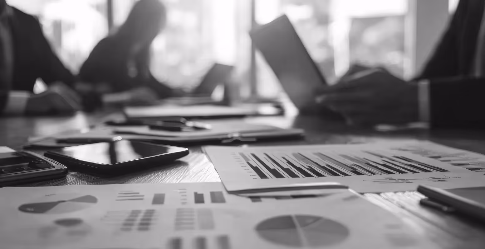 Commercial real estate team strategic planning with printed out documents