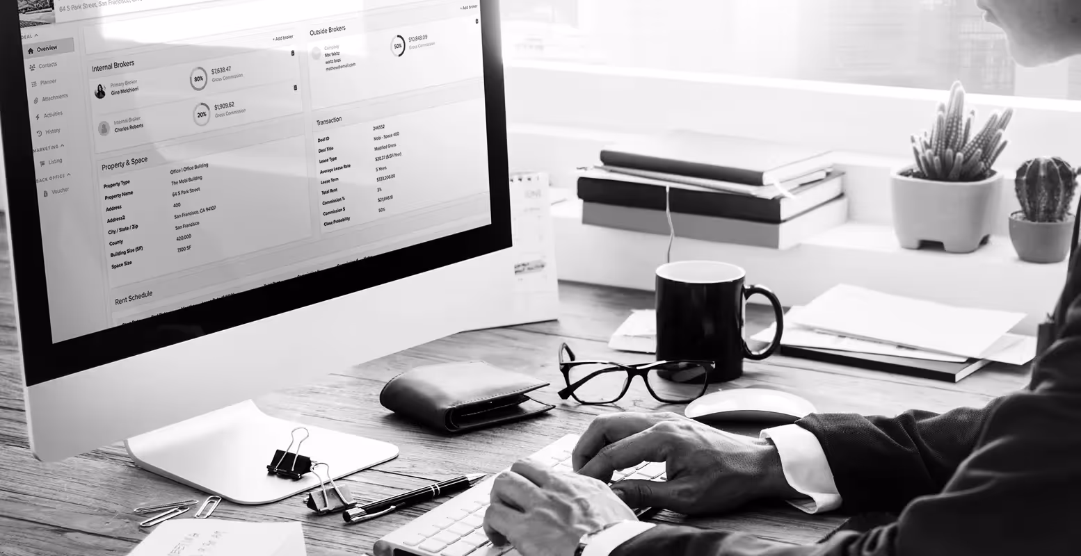 Man working on computer using Buildout's Manage & Close software