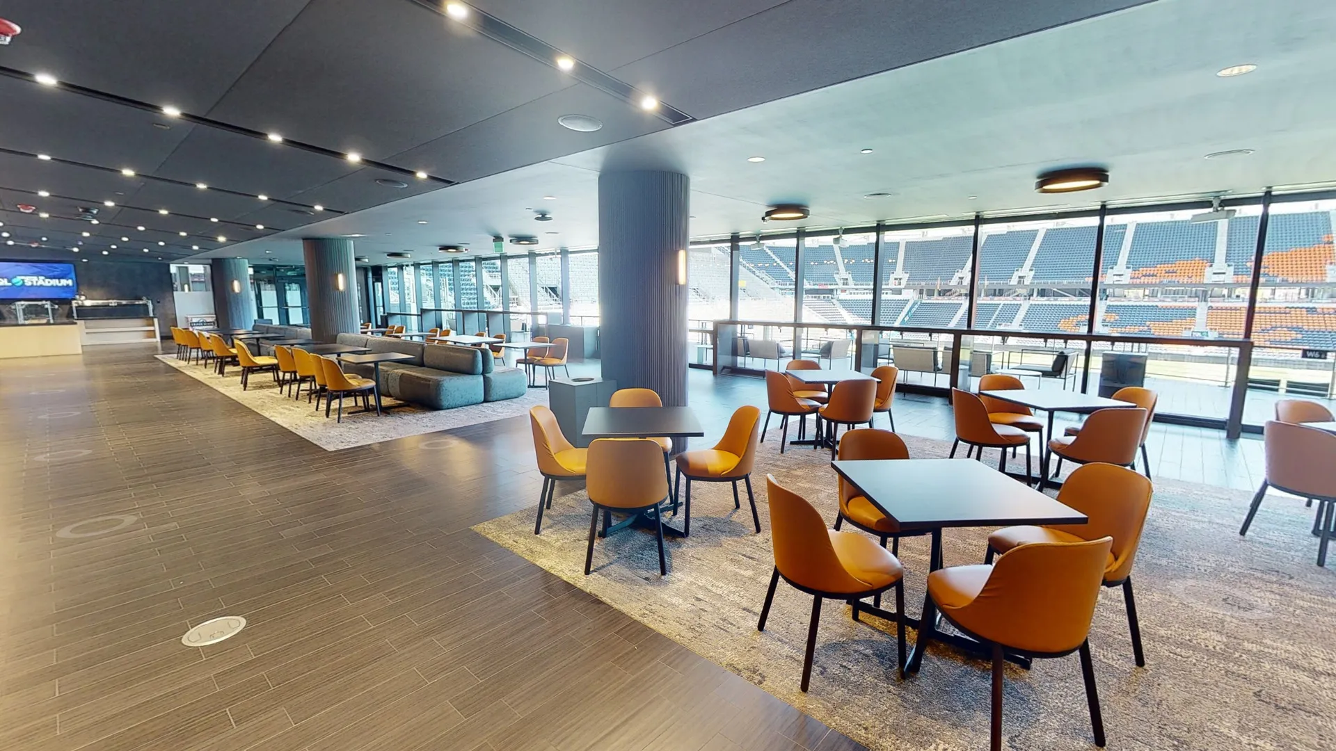 Buildout Virtual 3D Tour showcasing a modern event venue with lounge seating and stadium views.