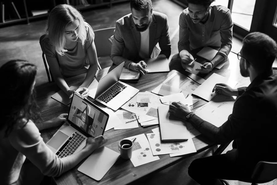 Group of marketers working around a table
