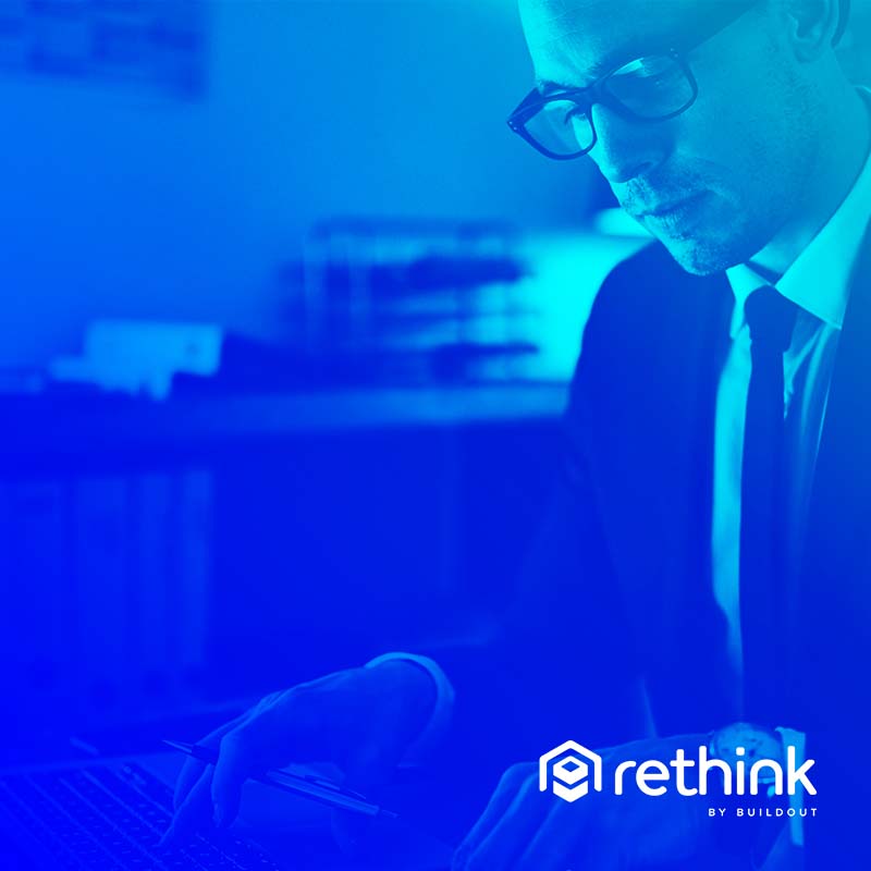 Man working on computer with a gradient overlay