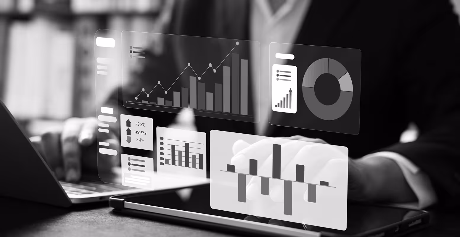 Business person looking at charts and graphs