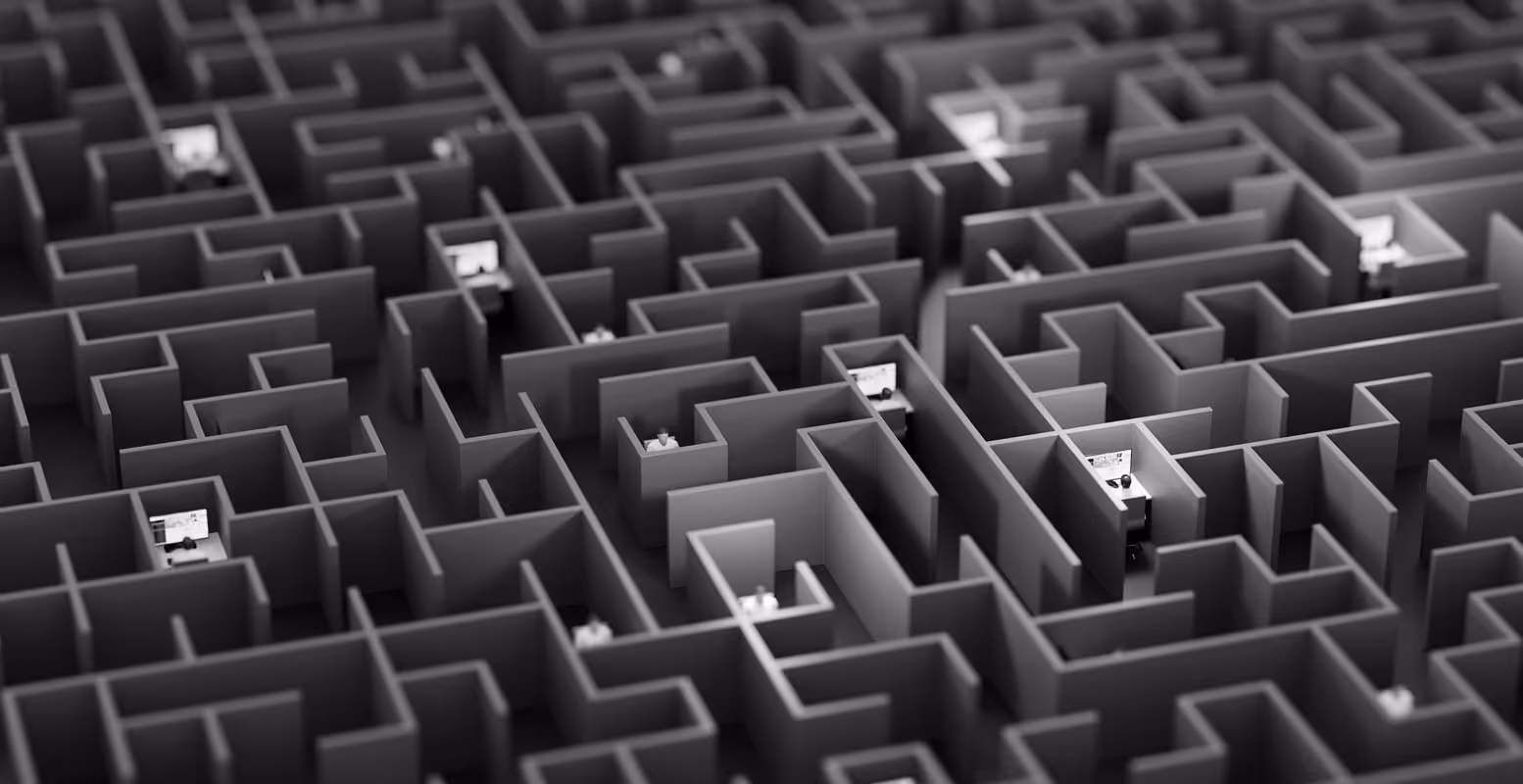 Stylized image of a labyrinth of office desks