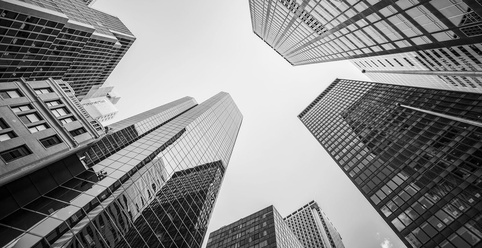 Upward photo from ground level of skyscrapers