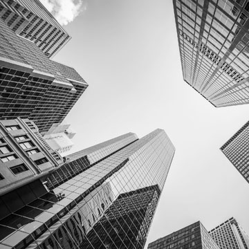 Upward photo from ground level of skyscrapers