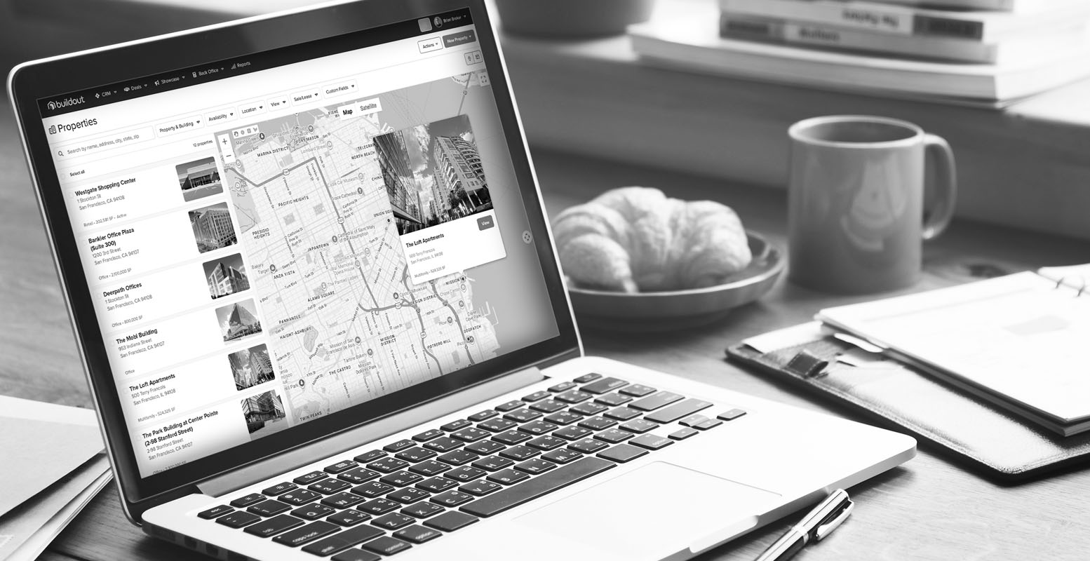 Laptop on desk with a view of Buildout CRM's property map view