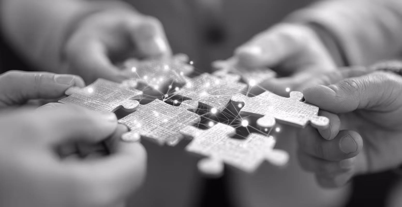People putting together puzzle pieces