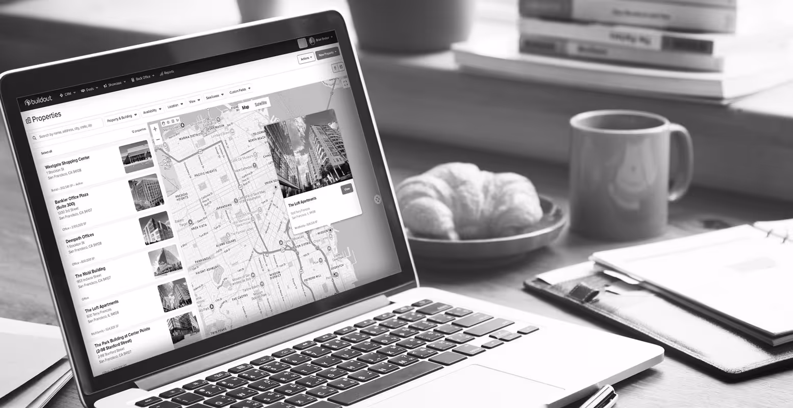 Laptop on a desk with a screenshot of Buildout CRM's property map