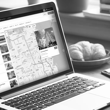 Laptop on a desk with a screenshot of Buildout CRM's property map