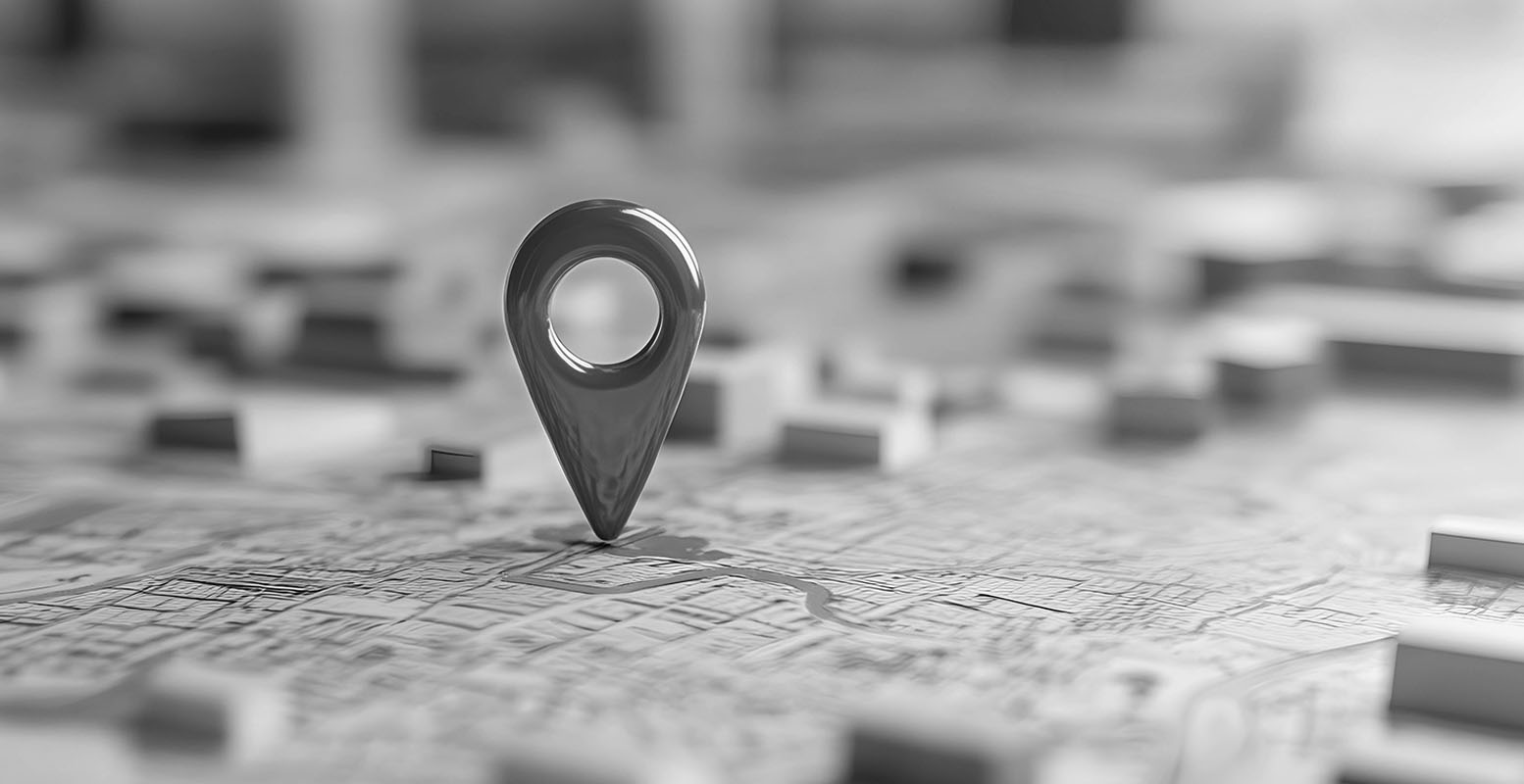 Close-up image of a map with a pin in it