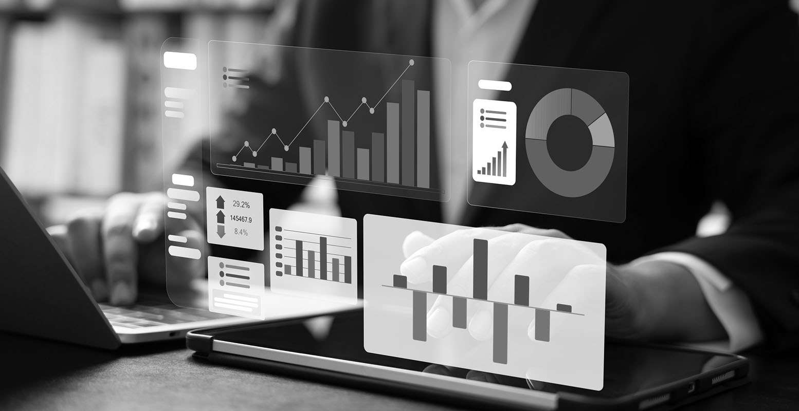 Financial graphs and charts overlayed atop a computer