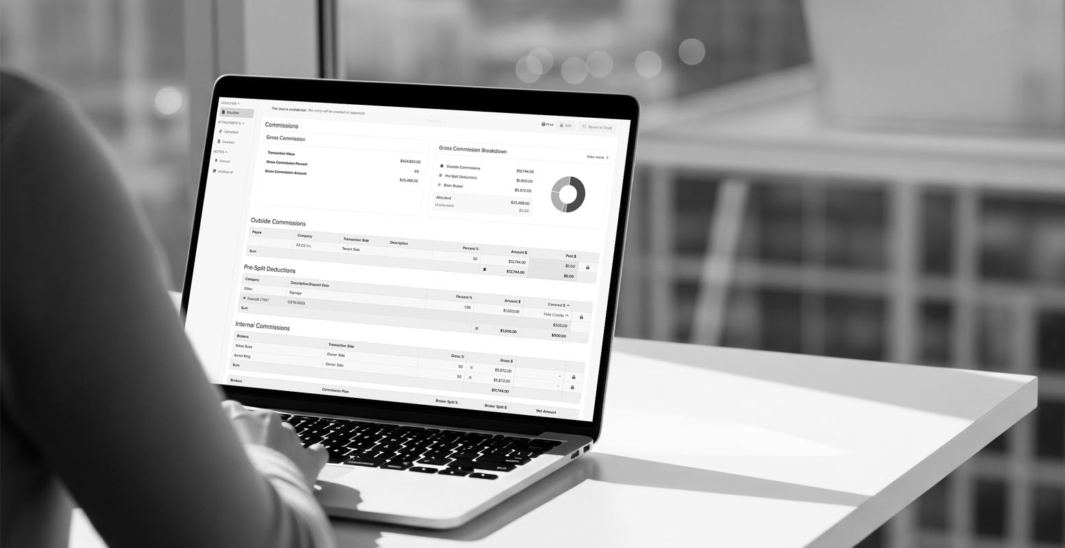 Person using Buildout's back office features on a laptop sitting at a desk