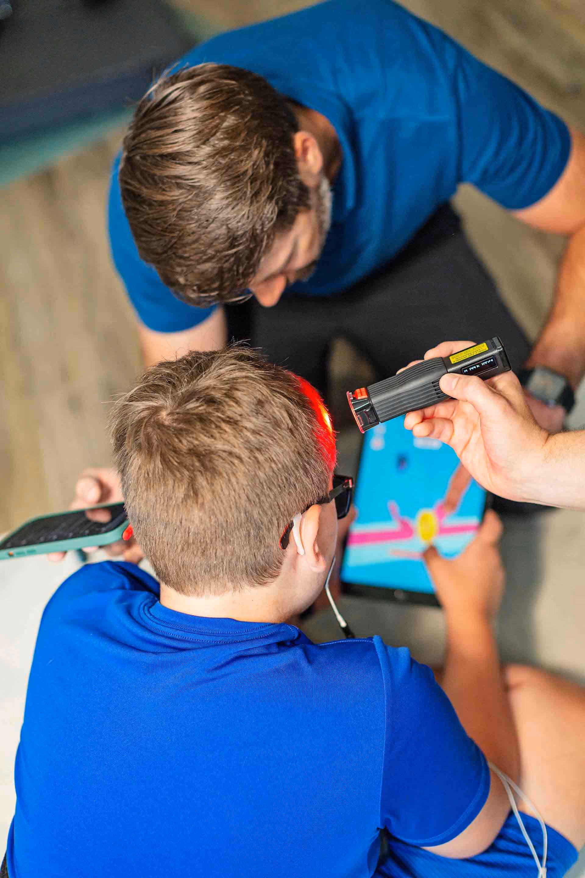 Dr. Brandon Crawford working with a pediatric patient at NeuroSolsution Center of Austin, Texas.