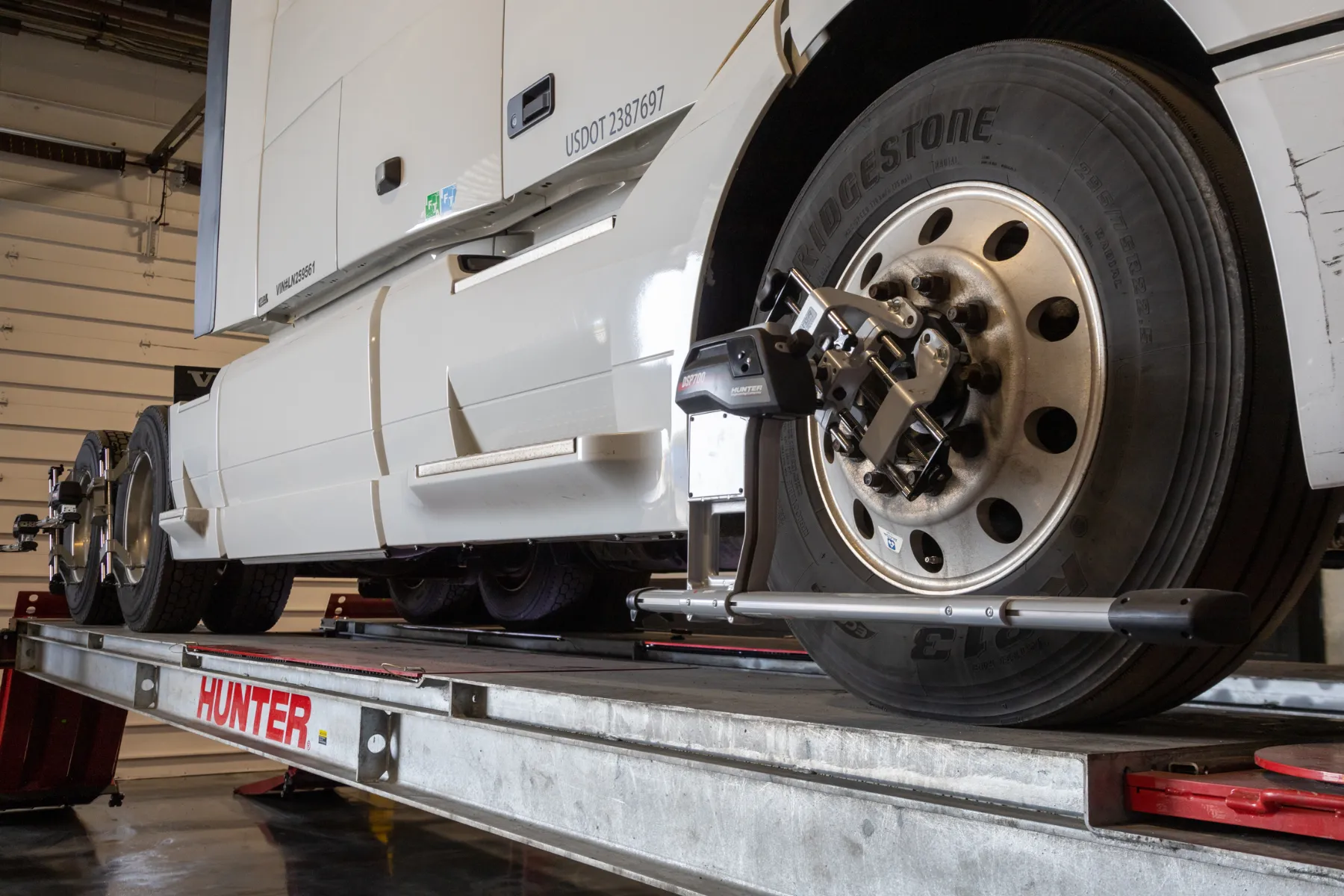 Diesel mechanic performing truck & trailer alignment service in Chicago, Illinois