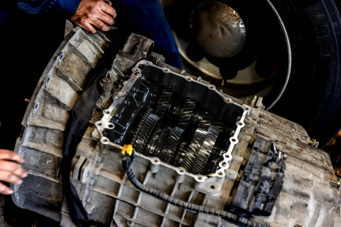 Diesel mechanic performing transmission repairs on semi truck in Bedford Park, Illinois
