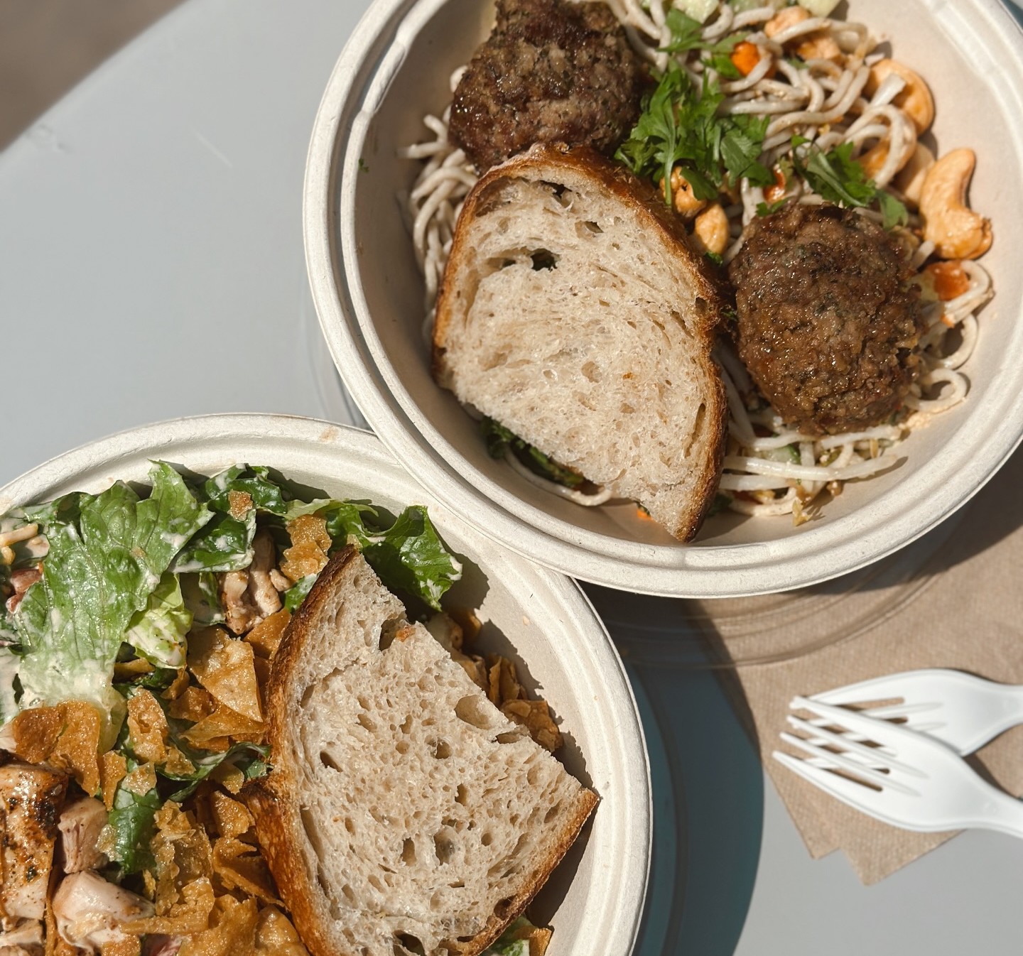 Southwest Ranch Salad and Spring Roll Bowl from Forage Kitchen on a white table.