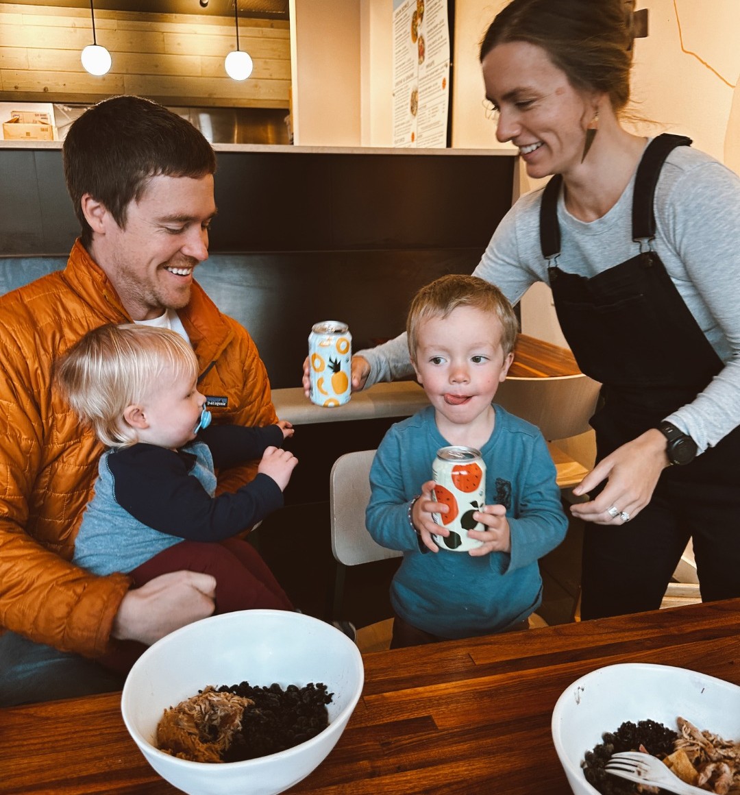  A family with two children holds tepache and eats grain bowls containing black rice at Forage Kitchen.
