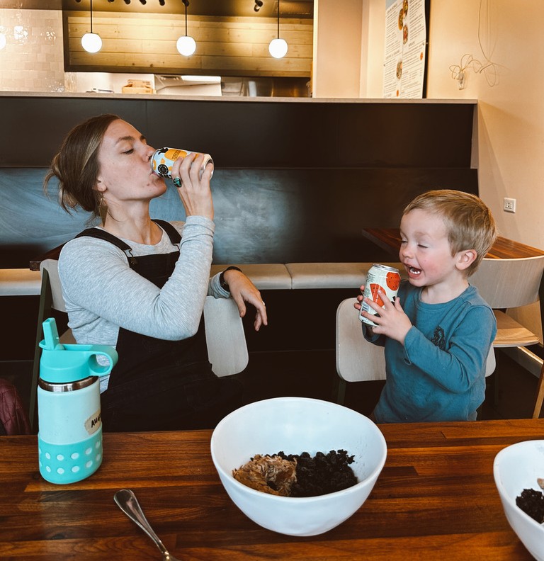 A mom and young son enjoy Forage Kitchen drinks together at Forage Kitchen restaurant.