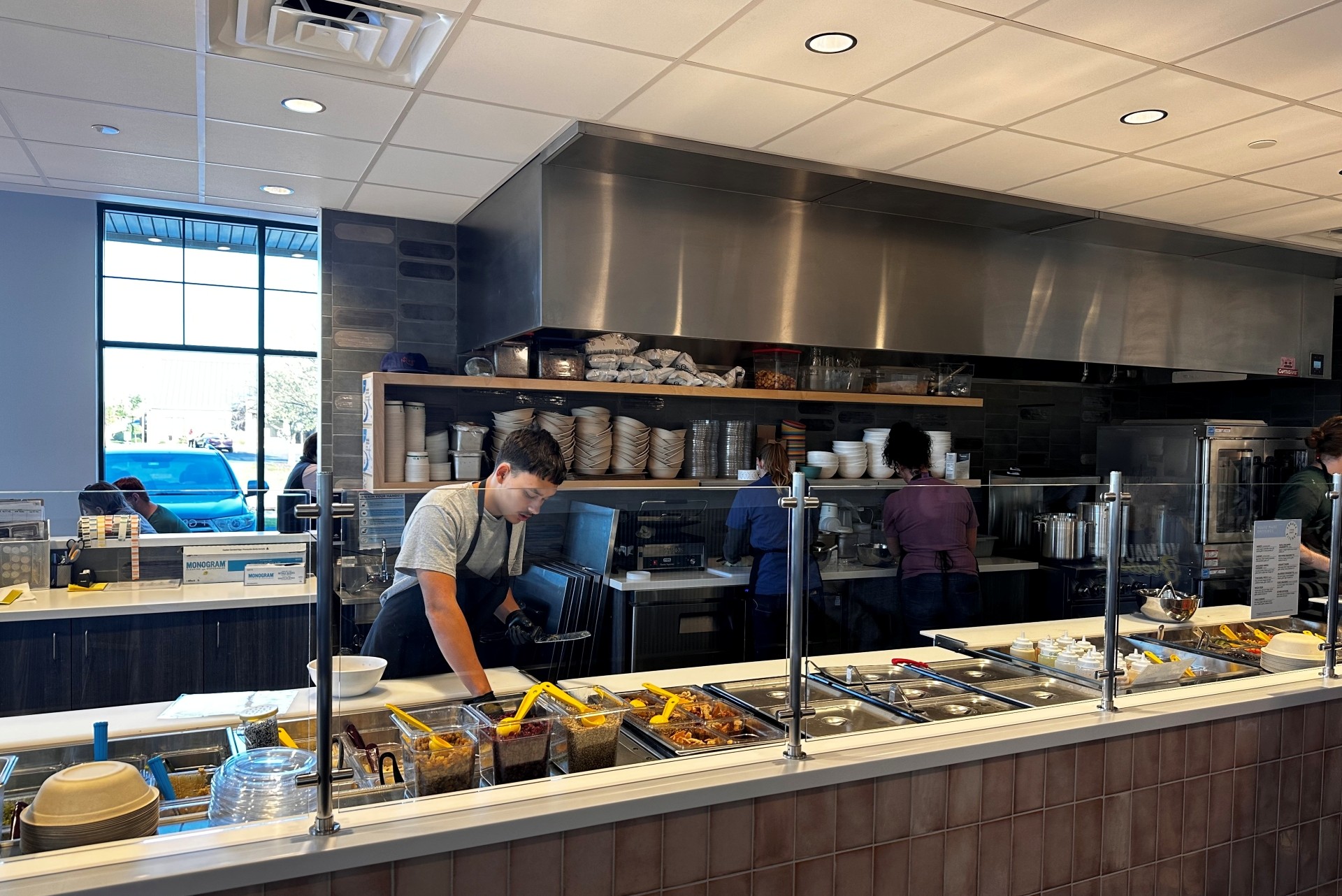 A team member builds bowls at Forage Kitchen in Pewaukee. 