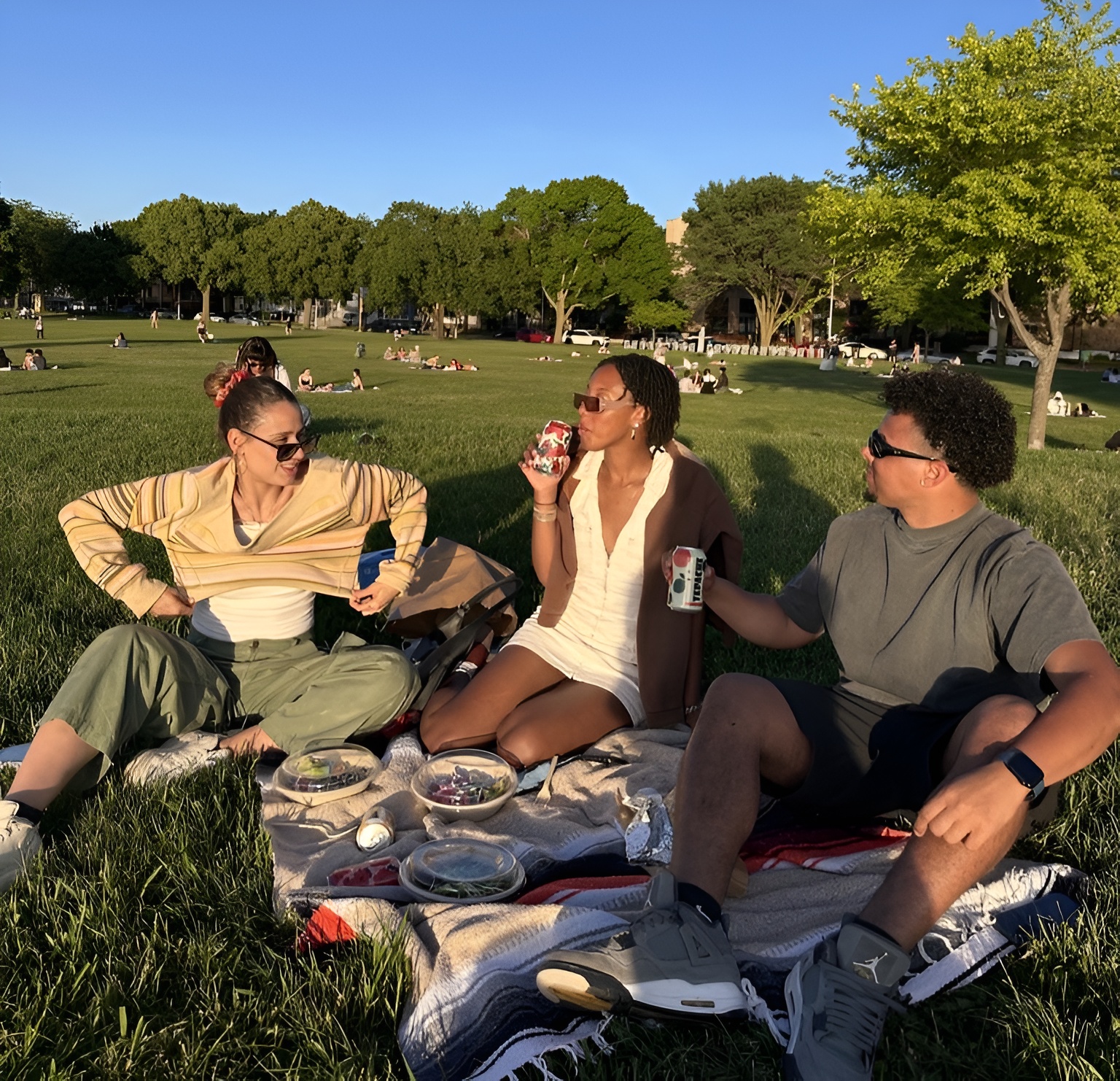 A group of friends enjoying a catered meal by Forage Kitchen.