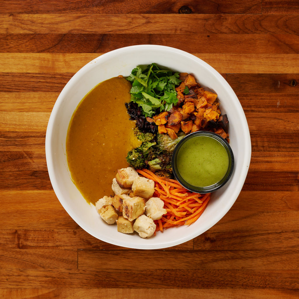 Forage Kitchen allergy-friendly Thai Bowl with tofu, organic black rice, sweet potato, broccoli, and Thai basil dressing.
