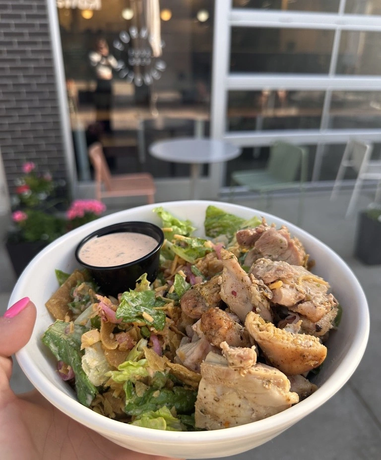 A fresh Southwest Ranch salad with spicy ranch on the patio outside Forage Kitchen.