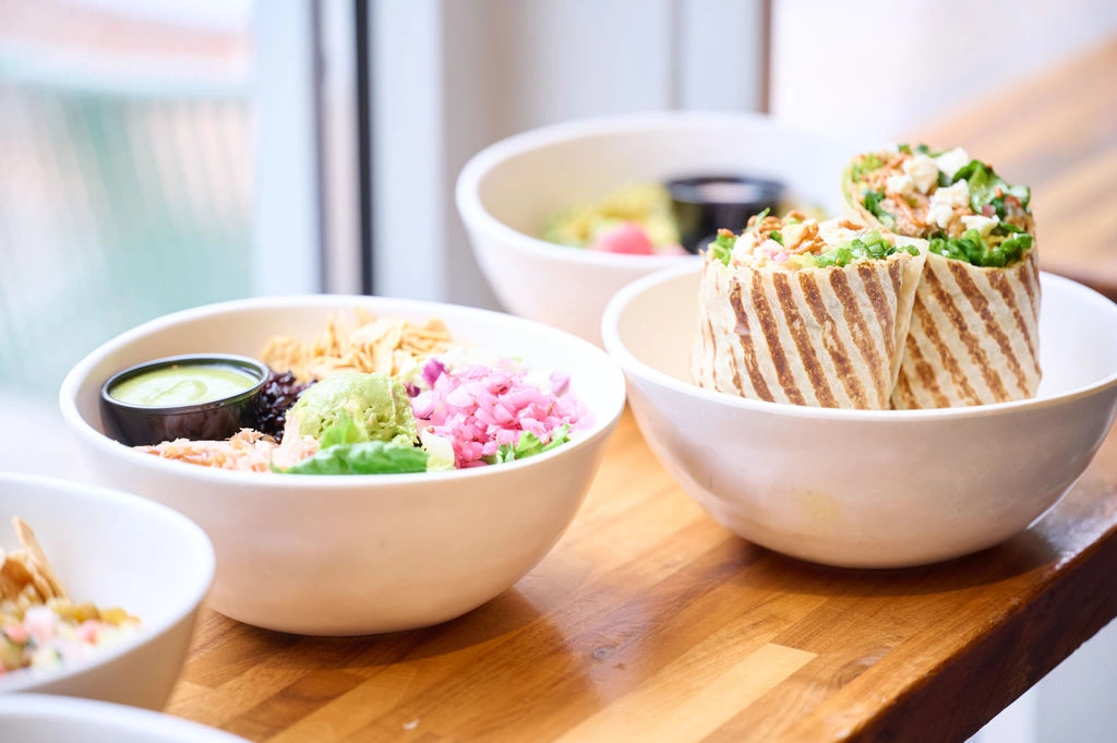  Freshly prepared wraps and vibrant healthy salad bowls at Forage Kitchen.