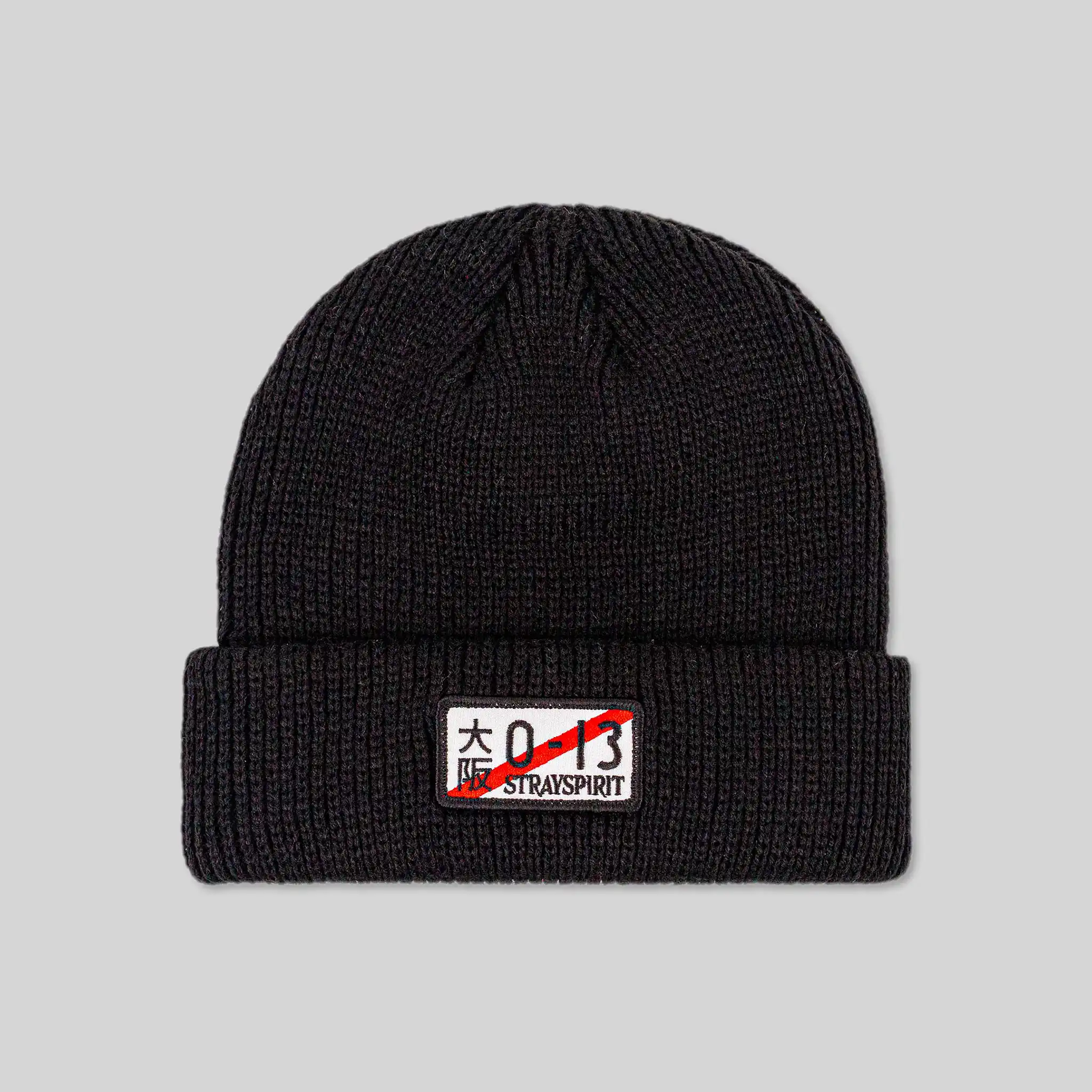 Flat image of the front of Straygang's 'Illegal' black beanie. The design includes a high-quality, custom embroidered patch, showcasing the finer details and quality of the product.