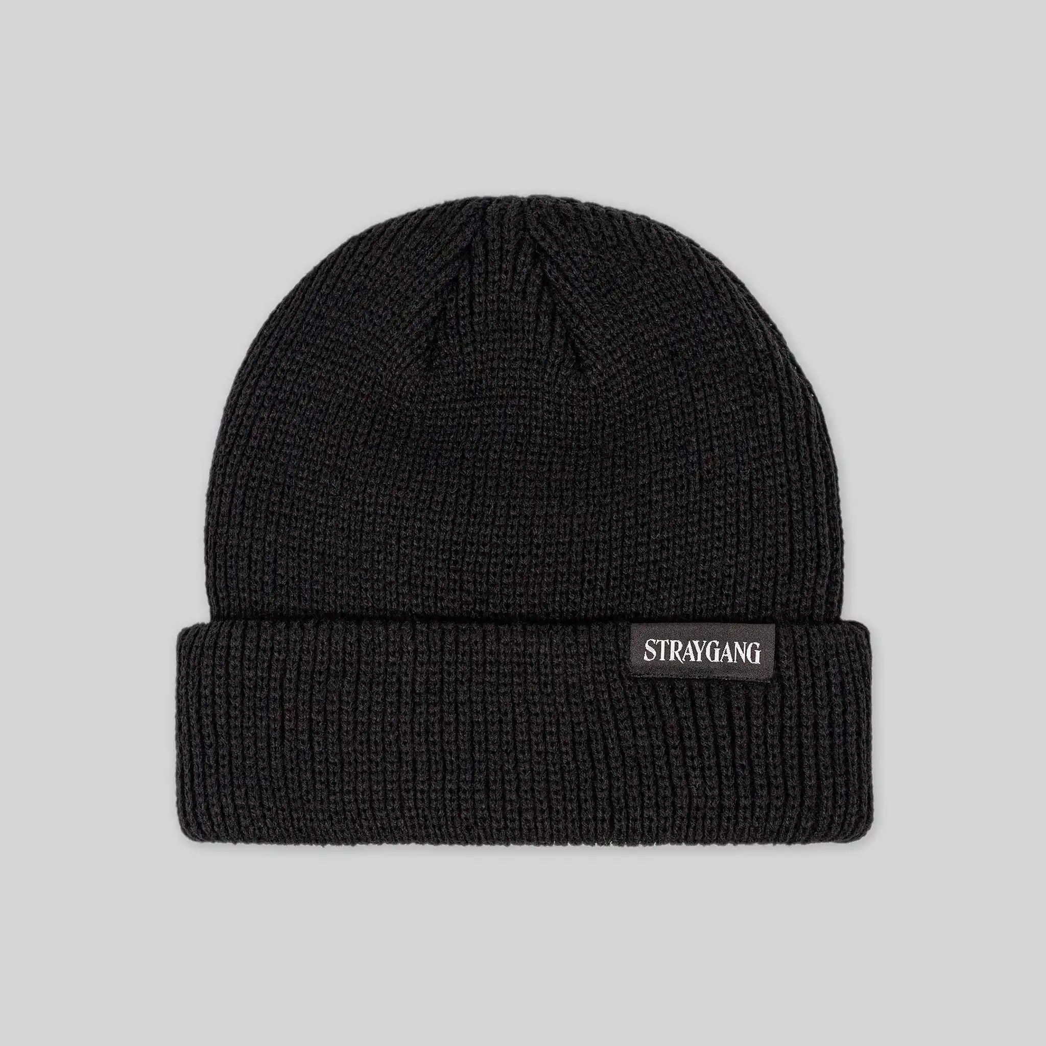 Flat image of the back of Straygang's 'Illegal' black beanie. This shot shows the custom woven patch, displaying typography that says 'Straygang' in a striking serif font.