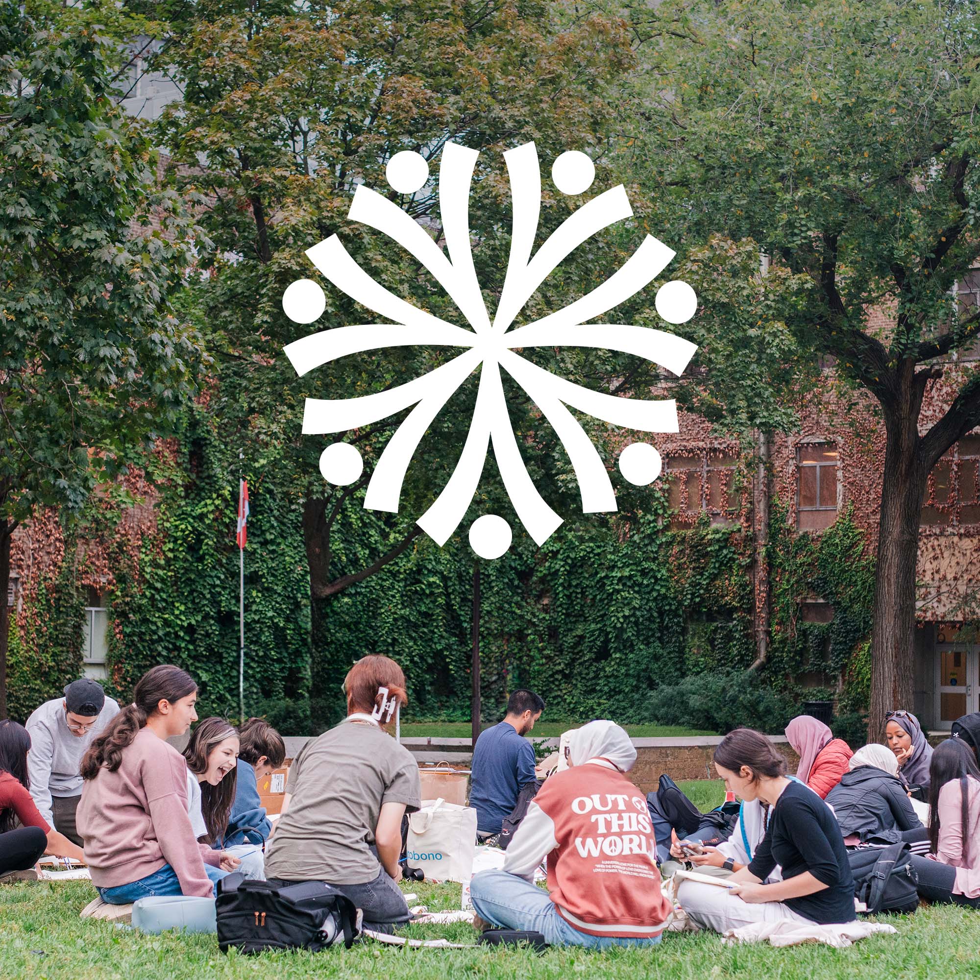 A group of youth and young adults sitting on green grass in a park with the Civic Circles logo above them. The logo is constructed from 7 abstracted stick figures arrange in a circle raising their arms in celebration outward from the centre.