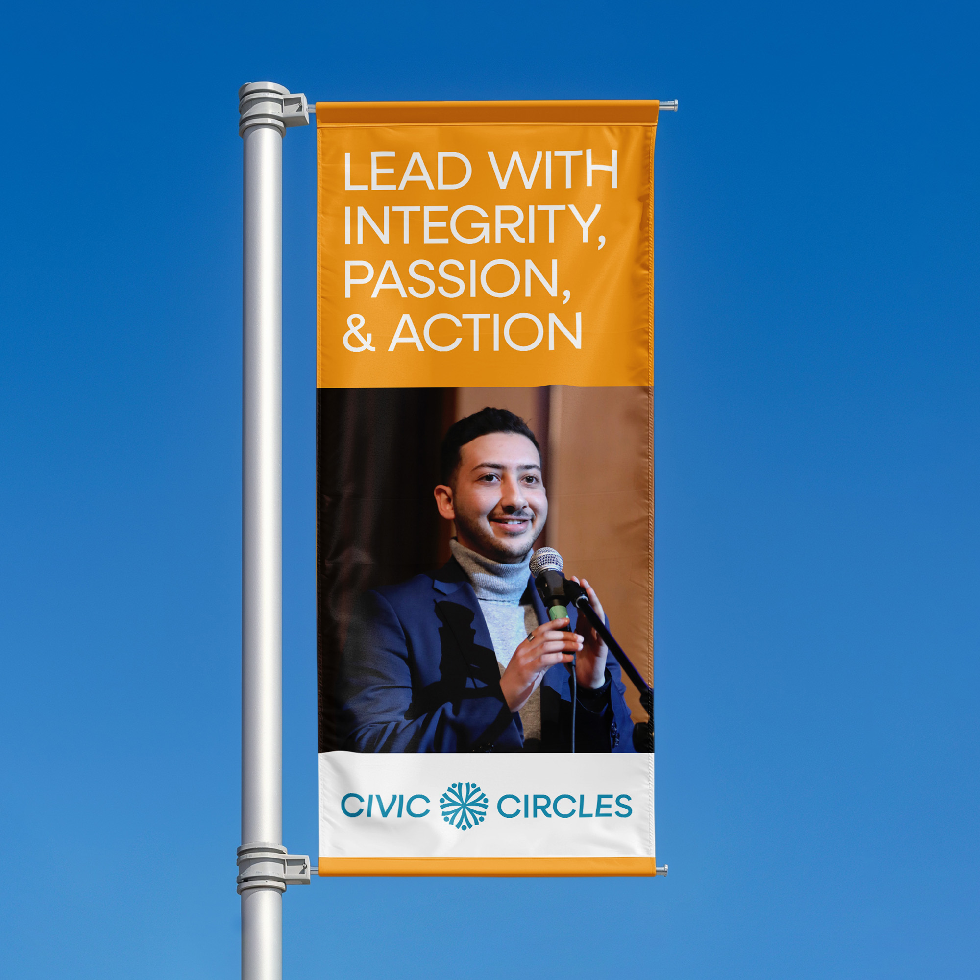 A design mockup showing a pole banner against a blue sky that says "Lead with integrity, passion and action."