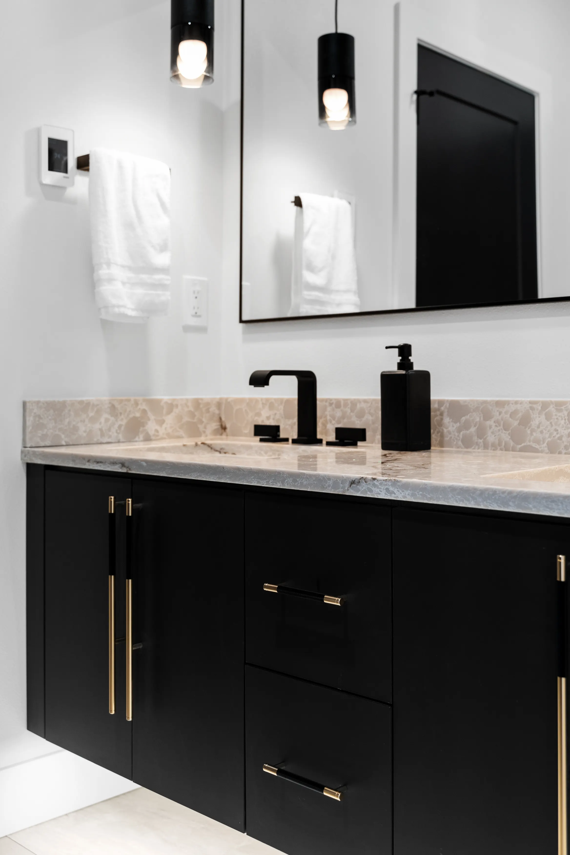 Custom-designed bathroom in Issaquah featuring a freestanding tub, walk-in glass shower, and contemporary tile finishes.