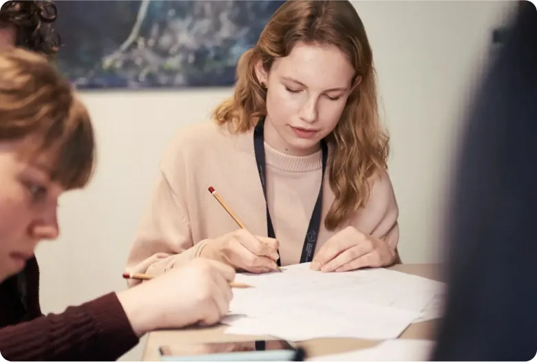 Woman writing on a piece of paper