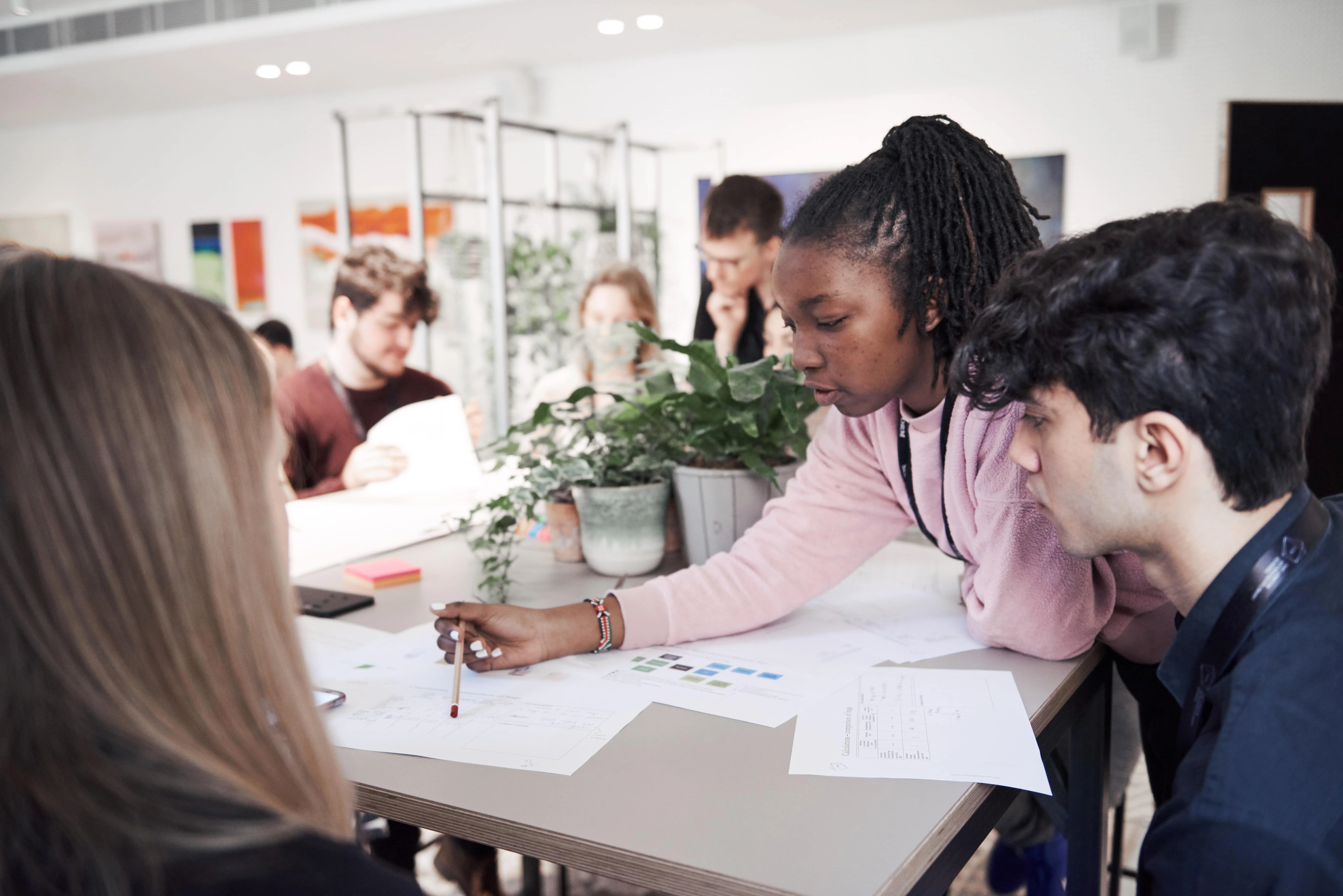Students collaborating at a table.