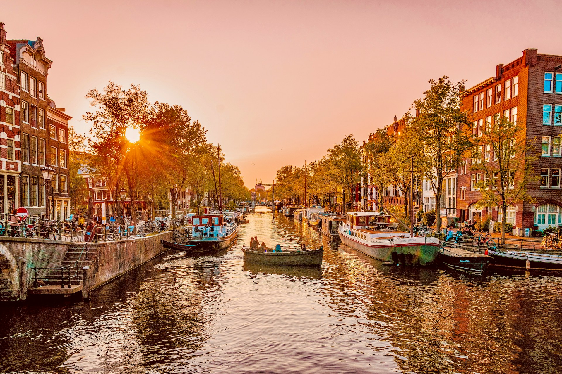 Student listening to lecturer in a busy classroom.