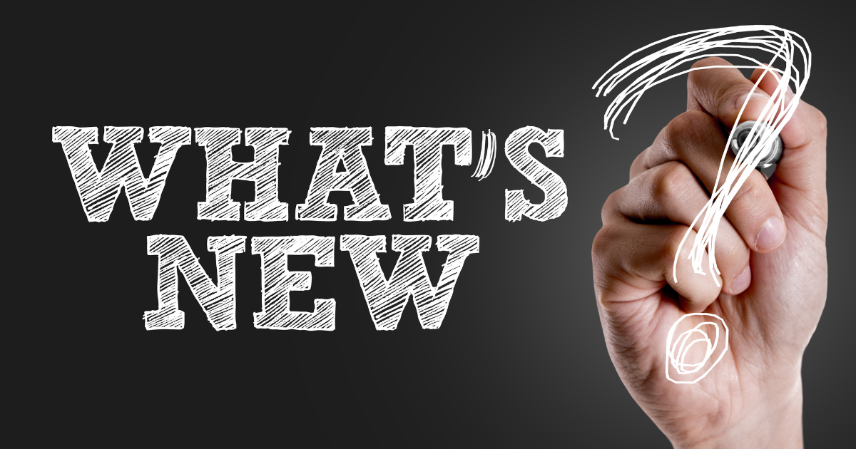 Black chalkboard background with hand writing 'What's New?"