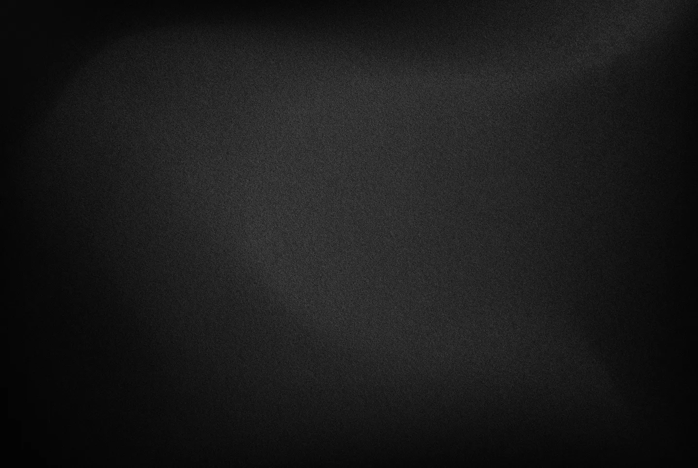 Dark textured gradient background with subtle black and gray tones.