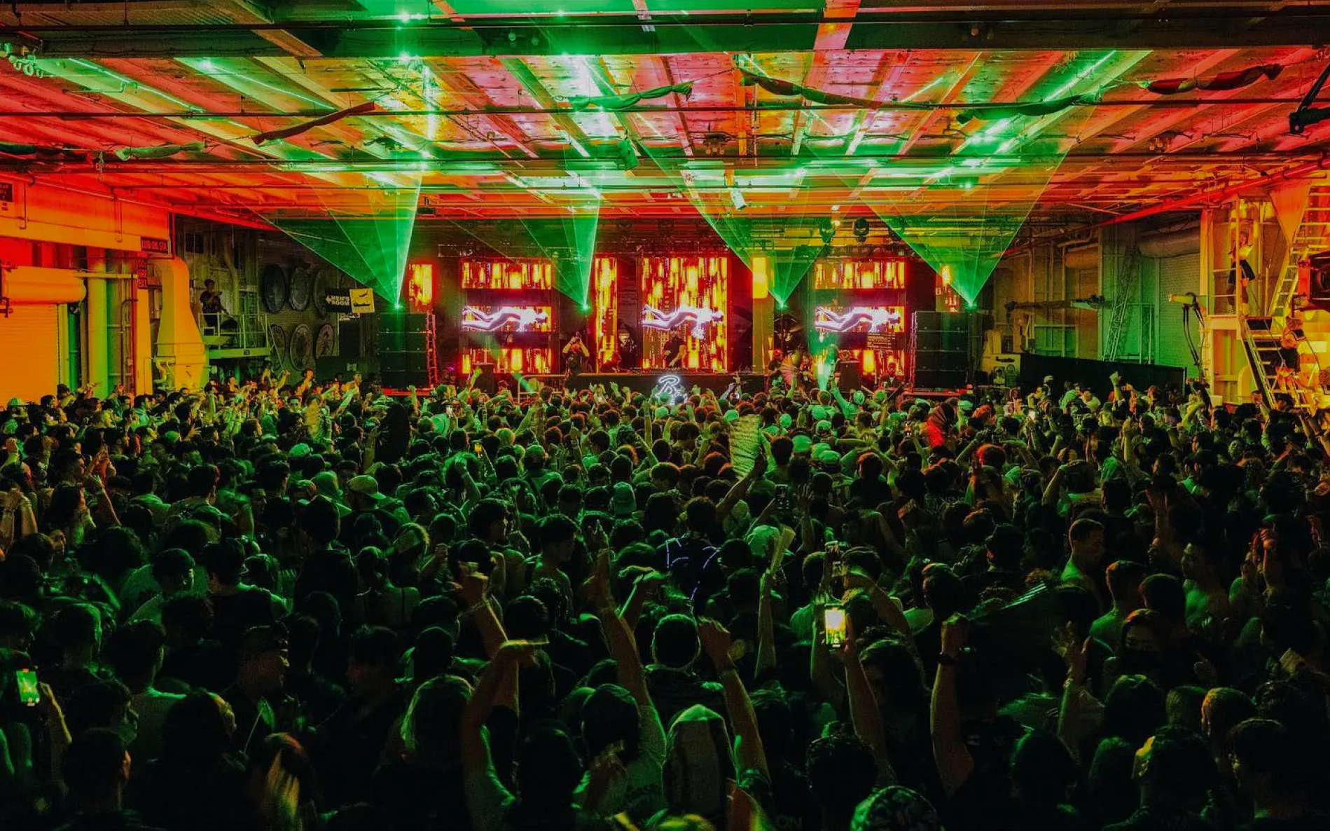A huge edm crowd on stage
