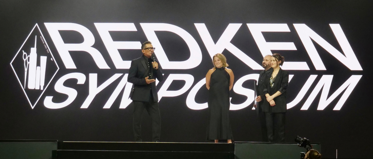 Speakers on the Redken Symposium 2026 mainstage at Caesars Forum in Las Vegas