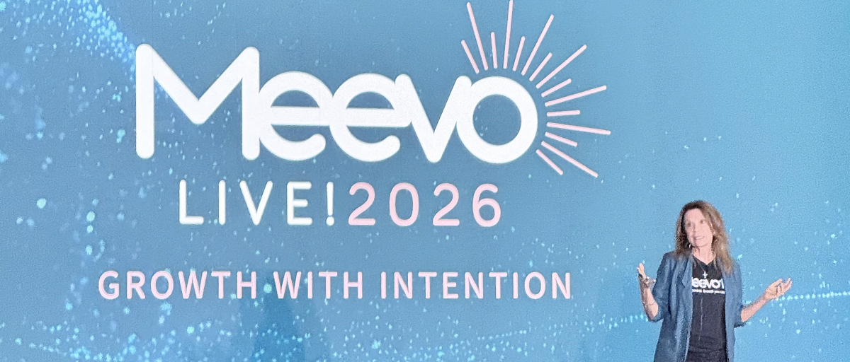 Speaker on stage at Meevo Live 2026 in Tampa in front of a Growth With Intention screen, recapping the salon software event