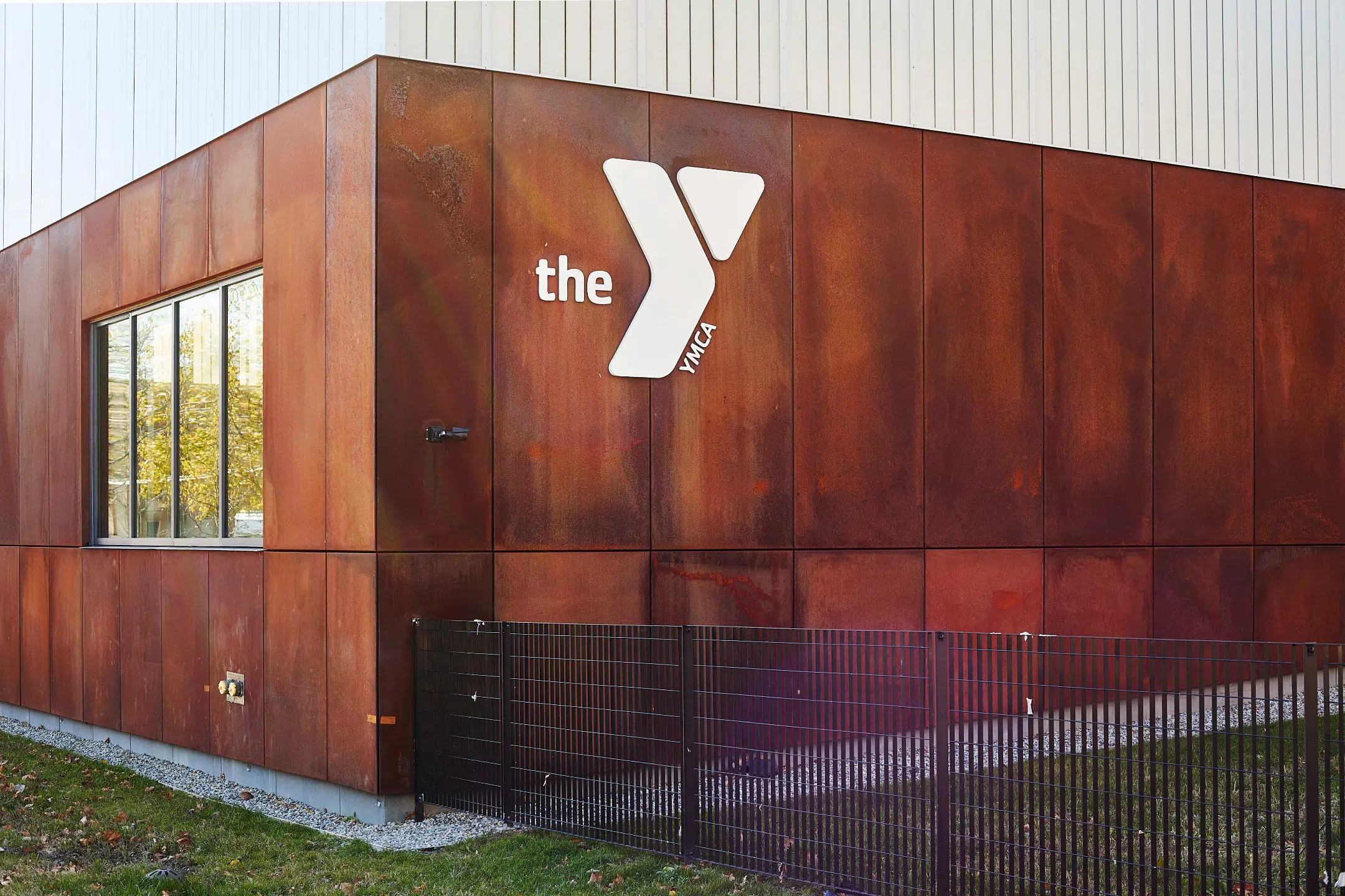 YMCA of Greater New York exterior white logo on corten steel