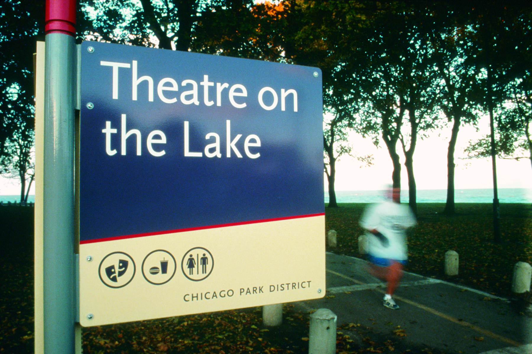 Chicago Park System exterior post-mounted blade sign identifying pedestrian pathway to Theater on The Lake with icons, designed by Two Twelve