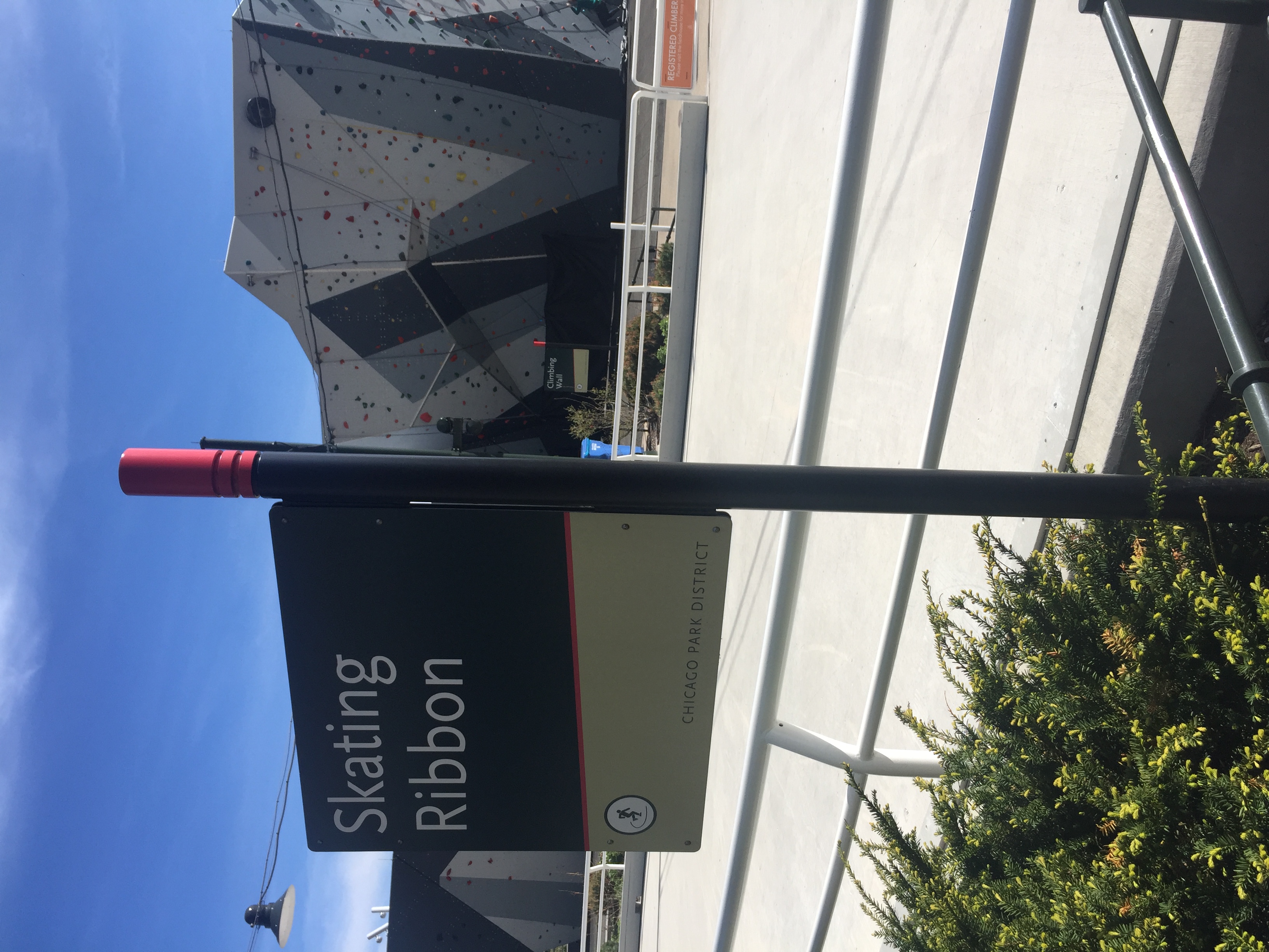 Chicago Park System exterior post-mounted blade sign identifying Slide Crater playground area with icon, designed by Two Twelve