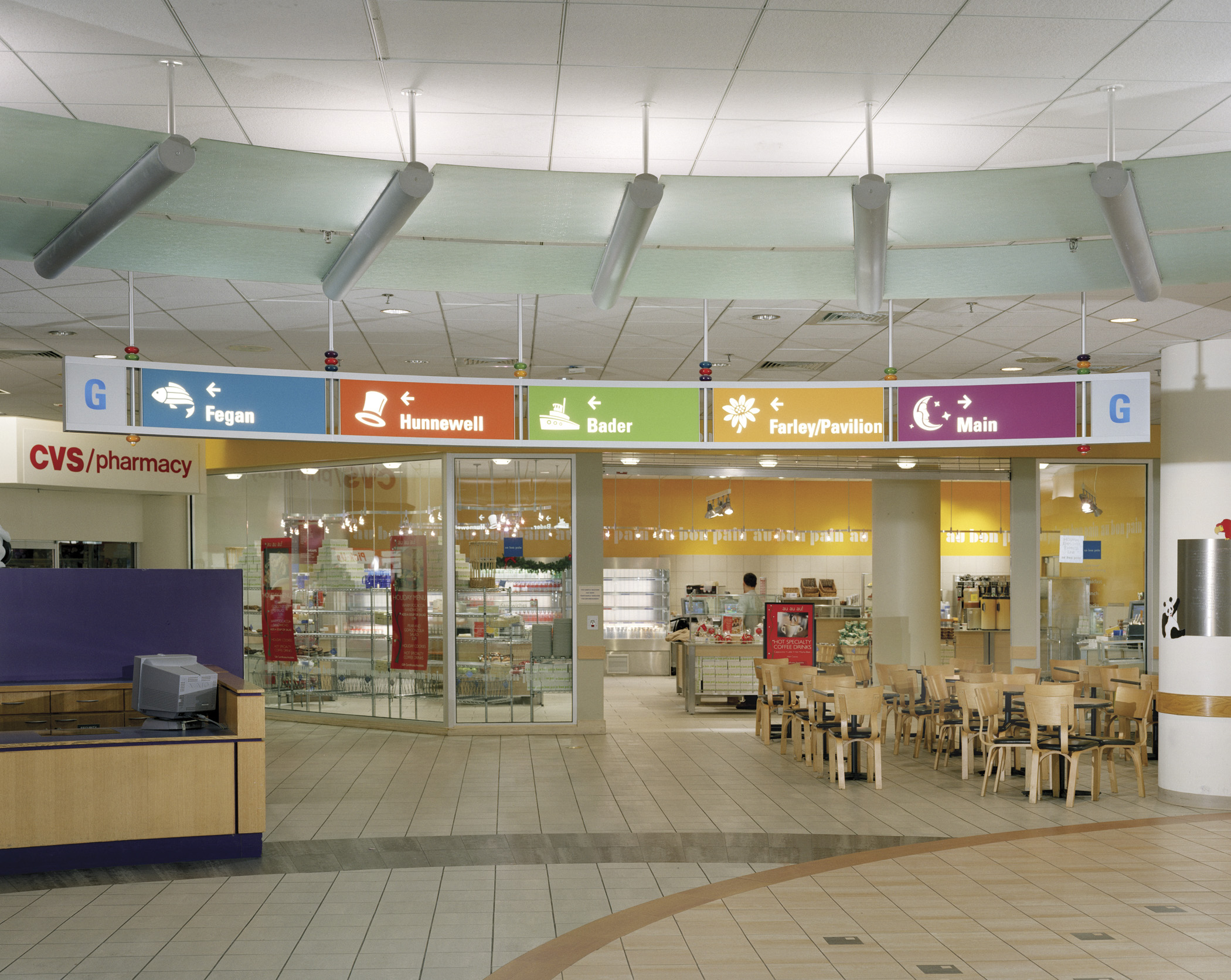 Children's Hospital Boston interior ceiling-mounted overhead directional sign with color-coded icons, designed by Two Twelve