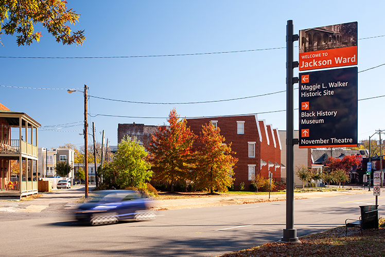 City of Richmond exterior post-mounted vehicular directional sign with orange color-coded arrows highlighting Jackson Ward, designed by Two Twelve
