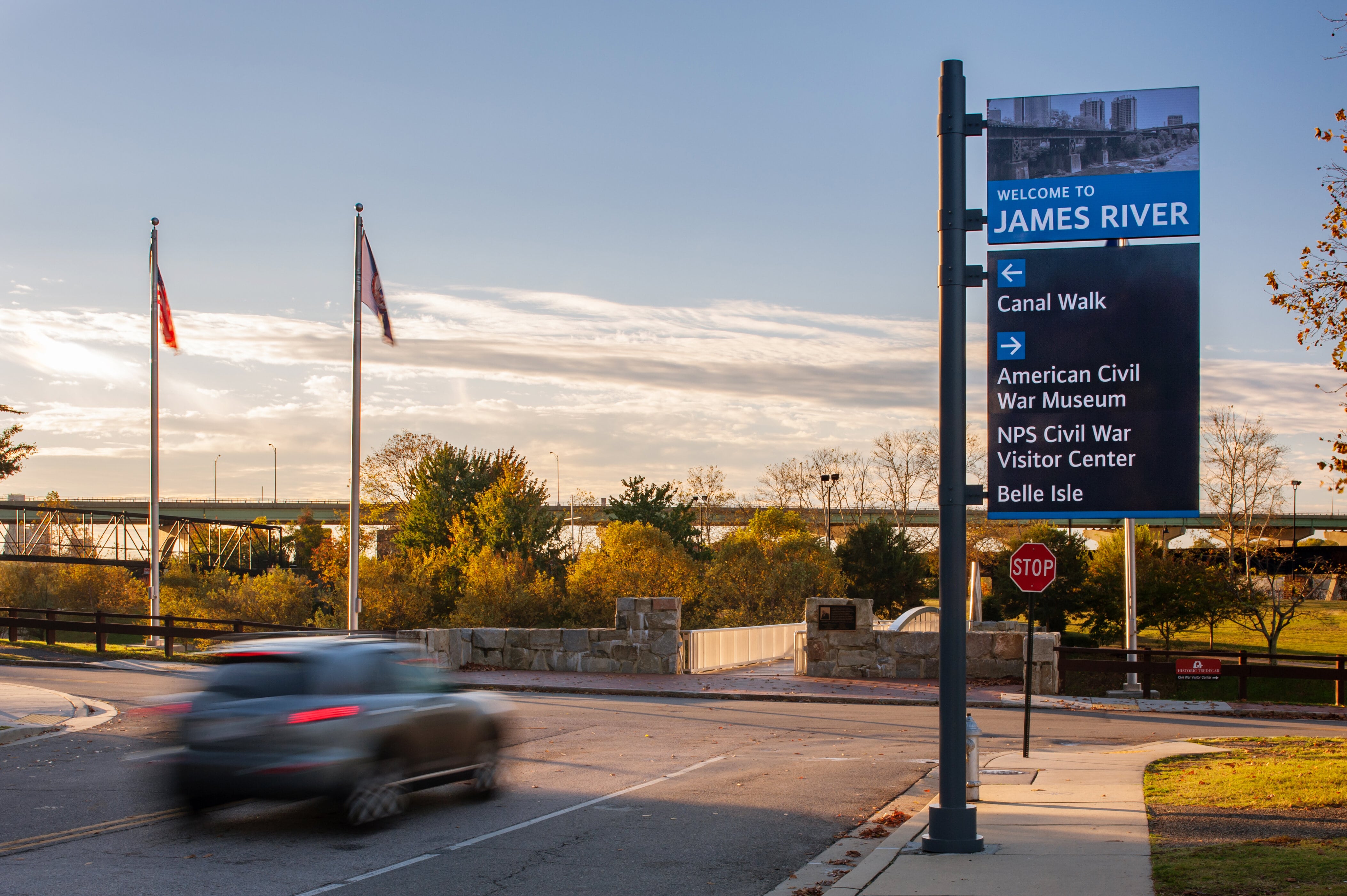 City of Richmond exterior post-mounted vehicular directional sign along street with blue color-coded arrows highlighting James River, designed by Two Twelve